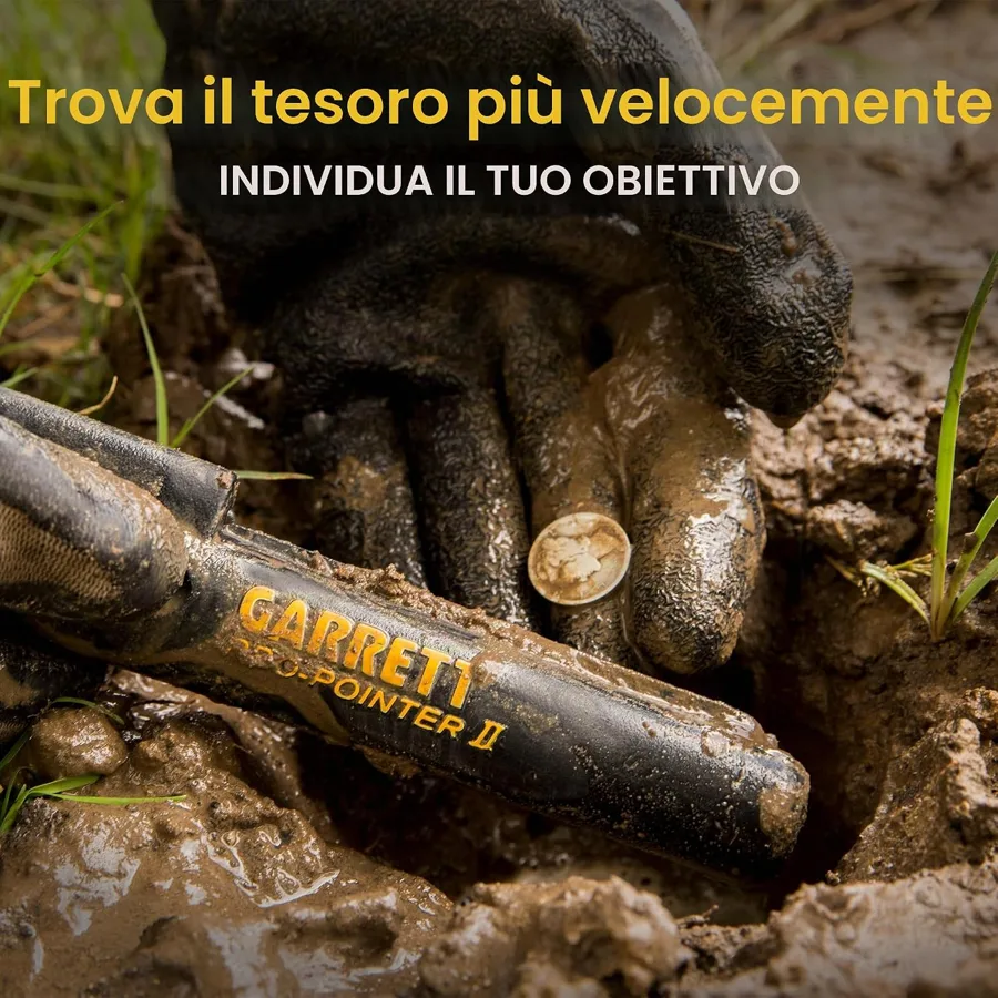 Garrett Pro-Pointer II nella terra accanto a una moneta